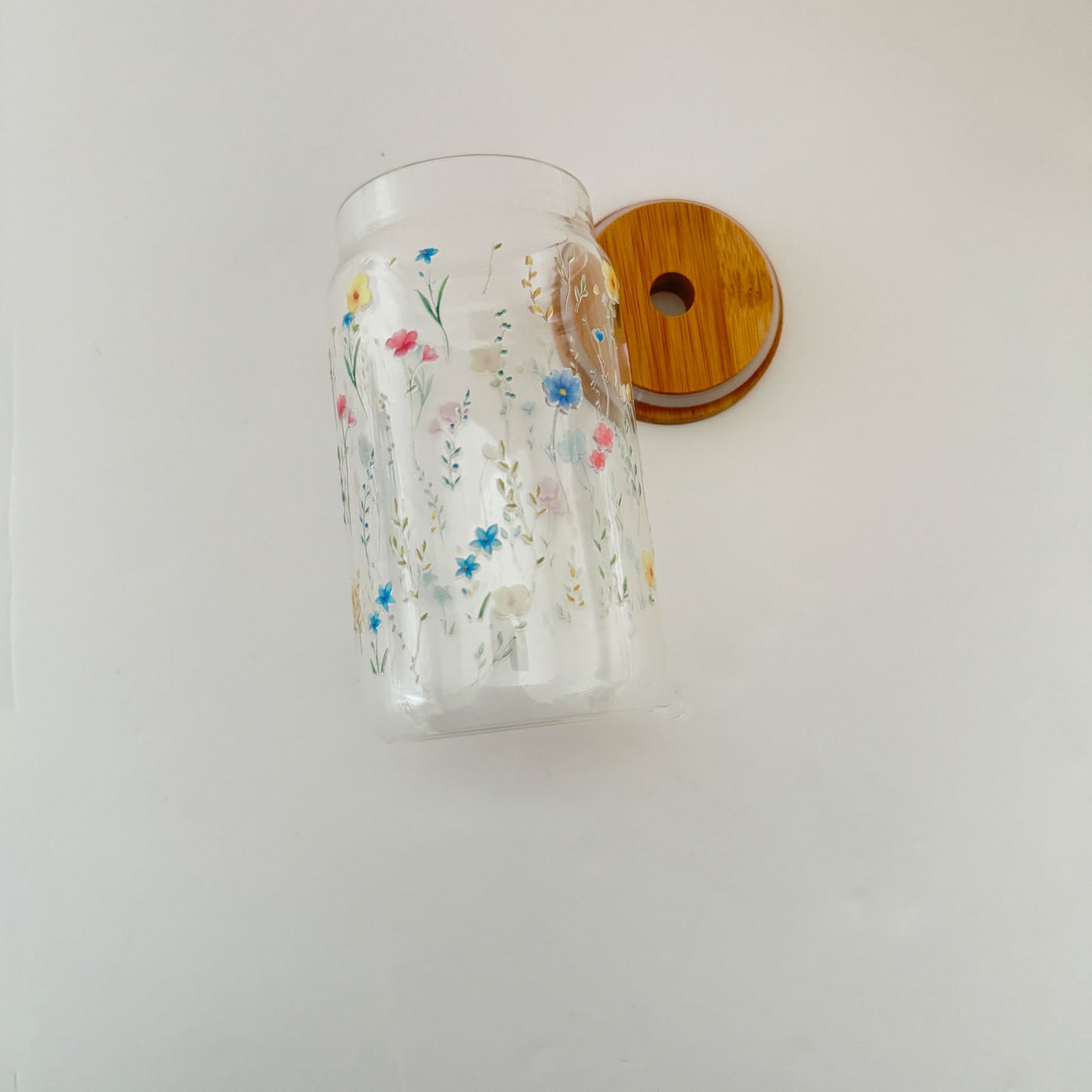 Made from sustainable bamboo, these cups are not only eco-friendly but they are reusable too! &nbsp;Perfect for gifting and reducing single-use plastic waste. Upgrade your daily coffee or tea routine with these stylish and sustainable cups.

Our glass cans are perfect for soft drinks, iced coffees, hot drinks and many more drinks! The glass comes with a bamboo lid and a glass straw which makes it even more perfect. Available in clear glass only.&nbsp;

Aprox 450 ml and holds 16oz liquid.